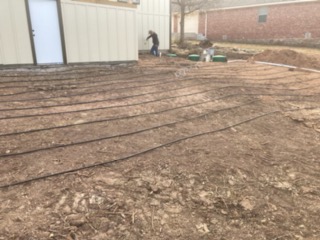 Septic system drain field lines laid out and ready for backfill in Brownwood, TX