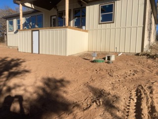 Newly installed septic system access risers at a new construction home in Central Texas
