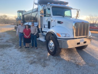 Darrell and Sharon Yarbrough in front of JD's Septic Service dump truck