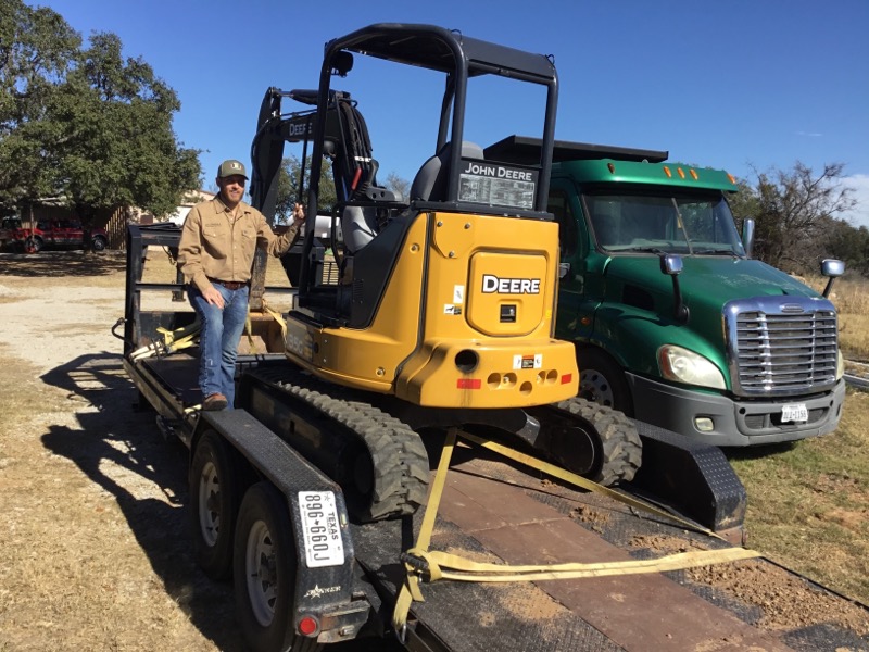 Chris Yarbrough with JD's Septic Service John Deere excavator and truck